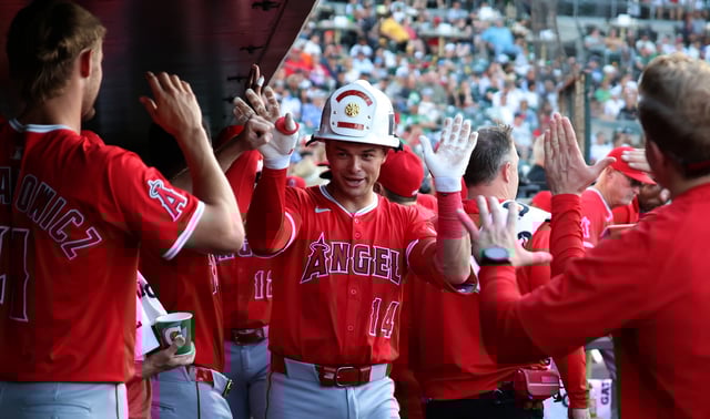 The Angels’ Logan O’Hoppe celebrates in the dugout after hitting a two-run home run during the second inning of their game against the Athletics on Wednesday night at Sutter Health Park in Sacramento. O’Hoppe hit two home runs in the 10-5 win. (Photo by Scott Marshall/Getty Images)