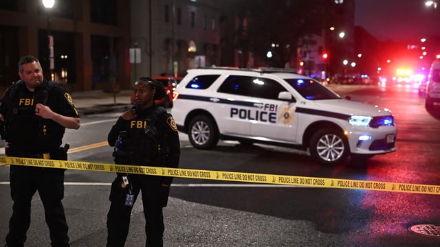 FBI agents cordon off the scene outside the Capital Jewish Museum following a shooting that left two people dead, in Washington, DC, on May 21, 2025. (Photo by Alex WROBLEWSKI / AFP)
