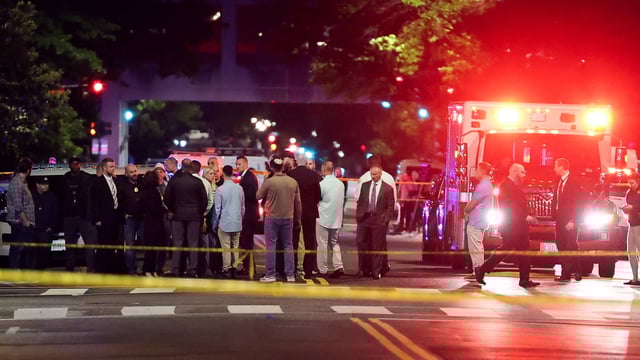 DC shooting: : US Attorney General Pam Bondi and Israeli Ambassador to the US Yechiel Leiter speak to the law enforcement officials as they visit the site where two Israeli embassy staff were shot dead near the Capital Jewish Museum in Washington.
