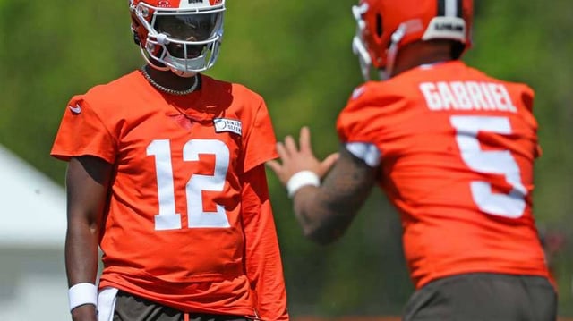 Cleveland Browns quarterback Shedeur Sanders (12) and quarterback Dillon Gabriel (5)
