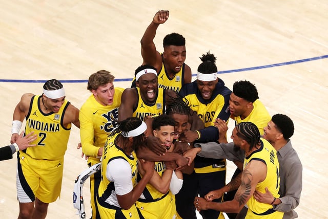 Tyrese Haliburton of the Indiana Pacers is congratulated by his teammates after scoring a game-tying basket against the New York Knicks, as time expired in the fourth quarter in Game 1 of the Eastern Conference Finals of the 2025 NBA Playoffs at Madison Square Garden in New York on May 21, 2025.