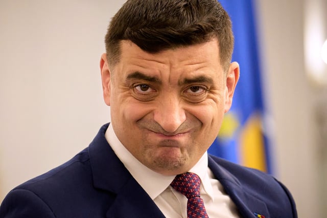 Presidential candidate George Simion waits to address members of the business community at the Chamber of Commerce and Industry of Romania, days ahead of the second round of the presidential election redo in Bucharest, Romania, Tuesday, May 13, 2025. (AP Photo/Vadim Ghirda)