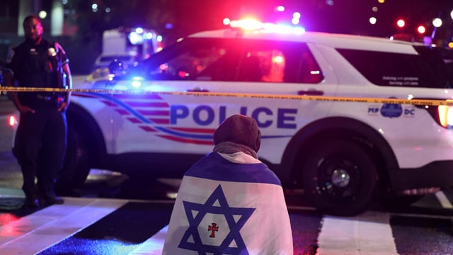 Emergency personnel work at the site where, according to the U.S. Homeland Security Secretary, two Israeli embassy staff were shot dead near the Capital Jewish Museum in Washington, D.C., U.S. May 21, 2025. REUTERS/Jonathan Ernst TPX IMAGES OF THE DAY