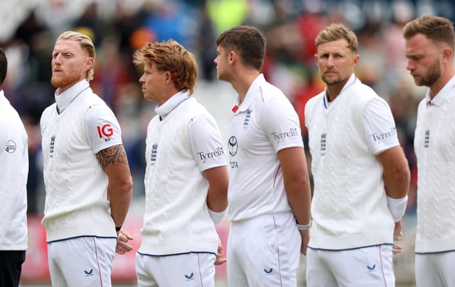 Cricket - International Test Match Series - England v Zimbabwe - Trent Bridge, Nottingham, Britain - May 22, 2025 England's Ben Stokes and Joe Root line-up with teammates for the national anthem before the match Action Images via Reuters/Paul Childs