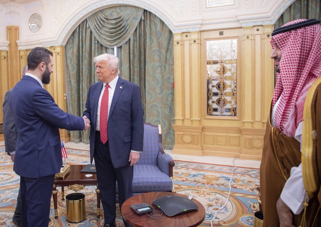 Tough Guy: Syrian President Ahmad al-Sharaa shakes hands with U.S. President Donald Trump in Riyadh, Saudi Arabia, last week. At right is Saudi Crown Prince Mohammed bin Salman.