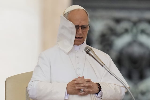 Pope Leo XIV holds his first weekly general audience in St. Peter's Square at The Vatican, Wednesday, May 21, 2025. (AP Photo/Gregorio Borgia)