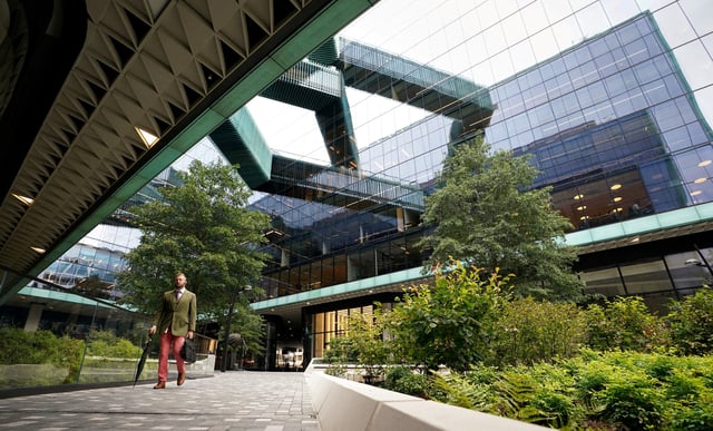 A man walks through a plaza at the new Fannie Mae headquarters in Washington, U.S., October 4, 2022. REUTERS/Kevin Lamarque/File Photo/File Photo