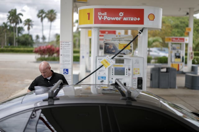 A customer pumps gas into their vehicle at a Shell station on April 10, 2025 in Miami, Florida.