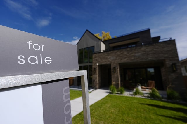 FILE - A sale sign stands outside a home on the market Thursday, Oct. 17, 2024, in the east Washington Park neighborhood of Denver. (AP Photo/David Zalubowski, File)