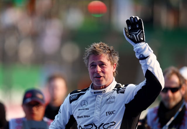 Formula One F1 - Mexico City Grand Prix - Autodromo Hermanos Rodriguez, Mexico City, Mexico - October 26, 2024 Actor Brad Pitt waves at fans during filming for an F1-inspired movie REUTERS/Raquel Cunha/File Photo
