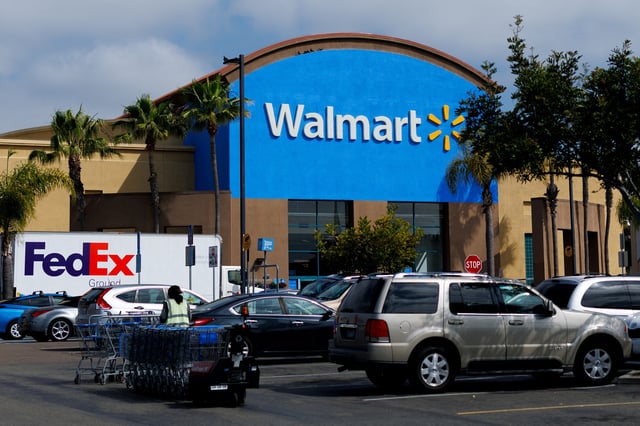 Cars are parked outside a Walmart store in  Oceanside, California, U.S., May 15, 2025. REUTERS/Mike Blake/File Photo