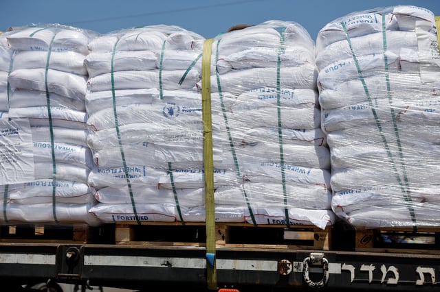 A view of an aid truck entering from Israel into Gaza, near the Kerem Shalom crossing near the Israeli-Gaza border, May 21, 2025. REUTERS/Amir Cohen