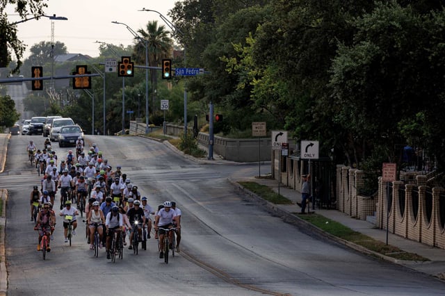 San Antonio cyclists ride down Ashby Place on Wednesday evening while participating in the annual Ride of Silence. They rode nearly 10 miles near downtown San Antonio in a commemorative procession to honor cyclists killed or injured on public roads.
