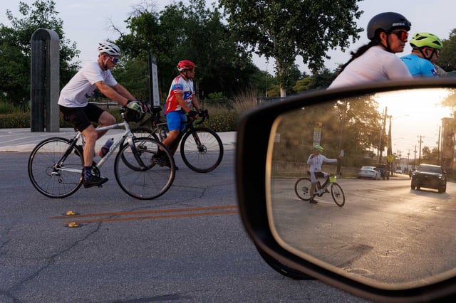 San Antonio cyclists travel down Josephine Street on Wednesday evening during the annual Ride of Silence. They rode nearly 10 miles near downtown San Antonio in a commemorative procession to honor cyclists killed or injured on public roads.