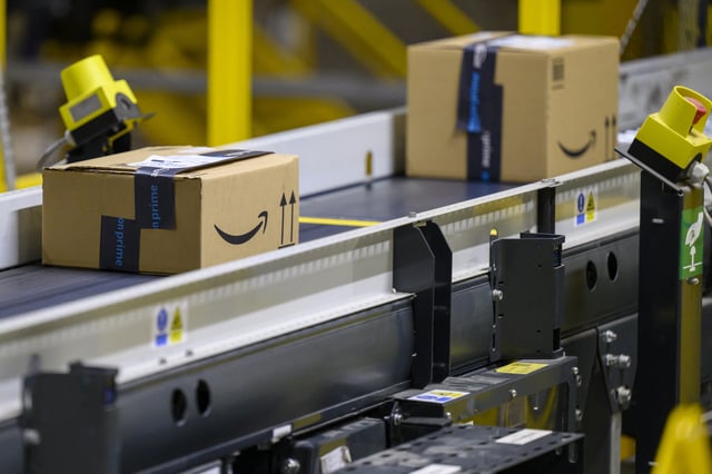 Boxes transported on a conveyor belt at the U.S. multinational company Amazon distribution centre in Augny, near Metz, eastern France, on August 29, 2024.