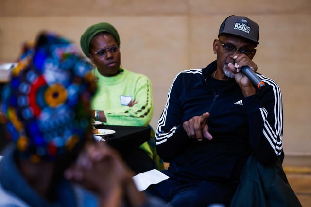 Greg Hodge, CEO of Brotherhood of Elders Network, speaks during the community meeting in support of Rise East in January.