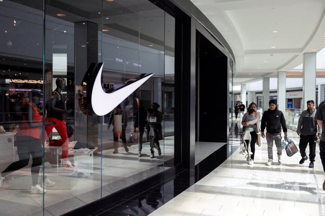Shoppers walk past a Nike store in the King of Prussia Mall, as global markets brace for a hit to trade and growth caused by U.S. President Donald Trump's decision to impose import tariffs on dozens of countries, in King of Prussia, Pennsylvania, U.S., April 3, 2025. REUTERS/Rachel Wisniewski/File Photo