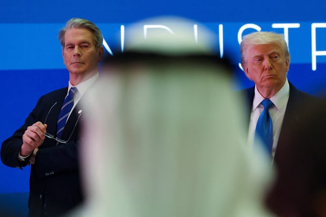 U.S. Secretary of the Treasury Scott Bessent and U.S. President Donald Trump attend a business forum at Qasr Al Watan during the final stop of his Gulf visit, in Abu Dhabi, United Arab Emirates, May 16, 2025.