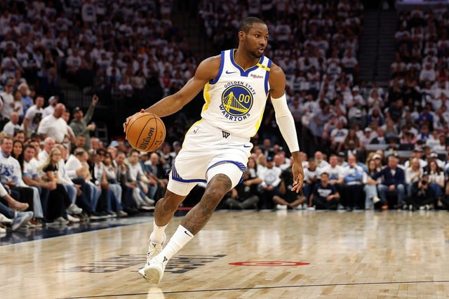 MINNEAPOLIS, MINNESOTA - MAY 08: Jonathan Kuminga #00 of the Golden State Warriors dribbles the ball against the Minnesota Timberwolves in the first quarter of Game Two of the Western Conference Second Round NBA Playoffs at Target Center on May 08, 2025 in Minneapolis, Minnesota.