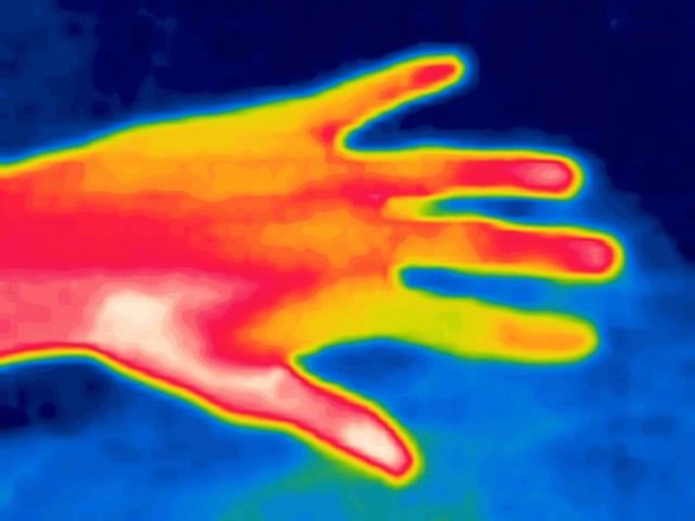 Hand gestures captured on infrared imager device. (Image by Maximillian cabinet on Shutterstock)