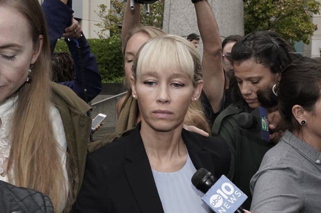 FILE - Sherri Papini leaves the federal courthouse after Federal Judge William Shubb sentenced her to 18 months in federal prison, in Sacramento, Calif., Monday, Sept. 19, 2022. Federal prosecutors had asked that she be sentenced to eight months in prison for faking her own kidnapping in 2016. 