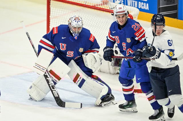 Ice Hockey - IIHF World Championships - Quarter Finals - United States v Finland - Avicii Arena, Stockholm, Sweden - May 22, 2025 Jeremy Swayman and Zeev Buium of the U.S. in action against Finland's Juuso Parssinen. Fredrik Sandberg/TT News Agency via REUTERS     ATTENTION EDITORS - THIS IMAGE WAS PROVIDED BY A THIRD PARTY. SWEDEN OUT. NO COMMERCIAL OR EDITORIAL SALES IN SWEDEN.