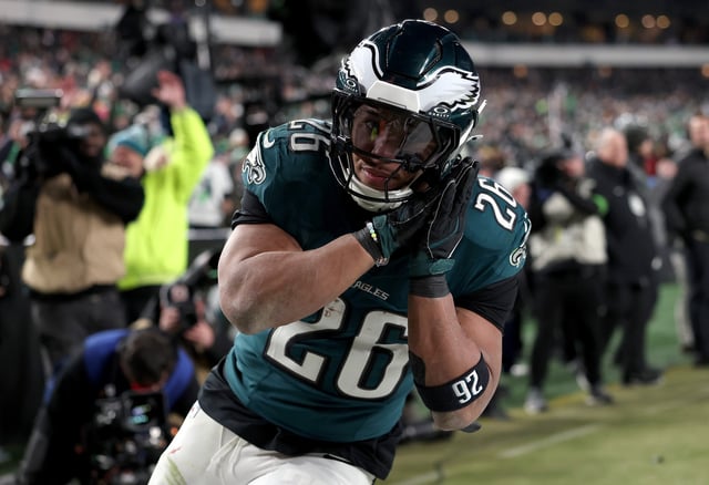 Saquon Barkley #26 of the Philadelphia Eagles reacts to his touchdown against the Washington Commanders during the fourth quarter in the NFC Championship Game at Lincoln Financial Field on January 26, 2025 in Philadelphia, Pennsylvania.