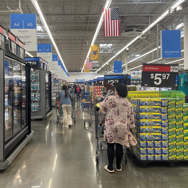 FILE PHOTO: Shoppers browse a Walmart Supercenter a day after U.S. President Donald Trump announced new tariffs, in Secaucus, New Jersey, U.S. April 3, 2025. REUTERS/Siddharth Cavale/File Photo