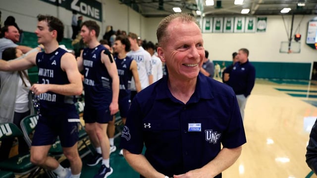 North Florida Ospreys head coach Matthew Driscoll is all smiles after an NCAA men’s basketball matchup Saturday, Feb. 1, 2025, at Jacksonville University. UNF held off a late rally from JU to win 81-78.