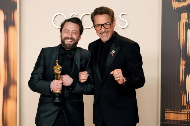 HOLLYWOOD, CALIFORNIA - MARCH 02: (L-R) Kieran Culkin, winner of the Best Actor in a Supporting Role award for &#34;A Real Pain,” and Robert Downey Jr. pose in the press room during the 97th Annual Oscars at Dolby Theatre on March 02, 2025 in Hollywood, California.