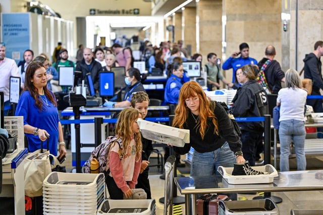 Travelers go though TSA security at John Wayne Airport in Santa Ana, Calif., on May 7, 2025.