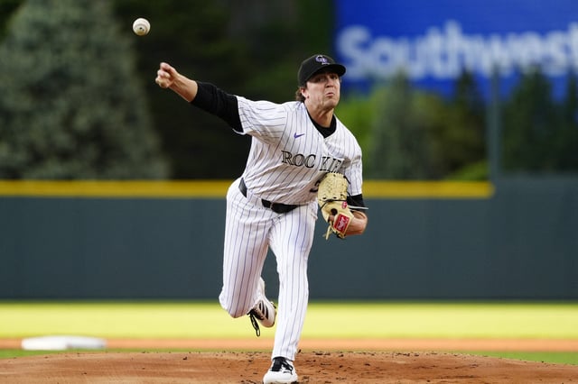 May 7, 2025; Denver, Colorado, USA; Colorado Rockies starting pitcher Chase Dollander (32) delivers a pitch in the first inning against the Detroit Tigers at Coors Field. Mandatory Credit: Ron Chenoy-Imagn Images