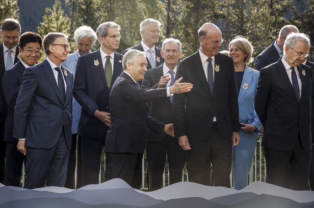 Canada's Finance Minister Francois-Philippe Champagne, centre, directs his colleagues to the meeting room following a family photo with colleagues at the G7 Finance Ministers meeting in Banff, Alta., Wednesday, May 21, 2025. THE CANADIAN PRESS/Jeff McIntosh