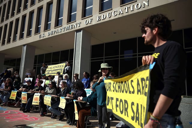 Protestors participate in the Rally to Defend Our Schools in front of the U.S. Department of Education on March 21, 2025, in Washington, D.C.