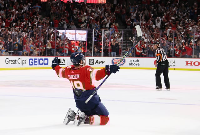 Matthew Tkachuk #19 of the Florida Panthers celebrates with his teammates after scoring the game winning goal on Frederik Andersen #31 of the Carolina Hurricanes during the third period in Game Four of the Eastern Conference Final of the 2023 Stanley Cup Playoffs at FLA Live Arena on May 24, 2023 in Sunrise, Florida.