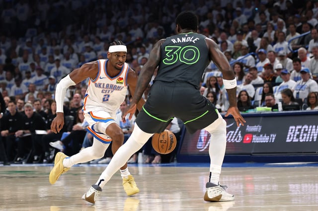 Shai Gilgeous-Alexander #2 of the Oklahoma City Thunder dribbles against Julius Randle #30 of the Minnesota Timberwolves during the first quarter in Game One of the Western Conference Finals of the 2025 NBA Playoffs at Paycom Center on May 20, 2025 in Oklahoma City, Oklahoma.