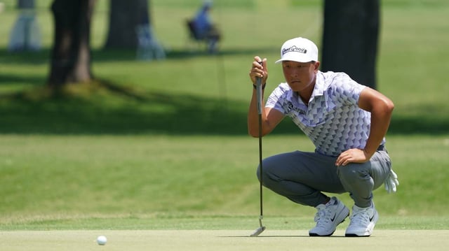May 22, 2025; Fort Worth, Texas, USA; John Pak lines up a putt on the sixth green during the first round of the Charles Schwab Challenge golf tournament.