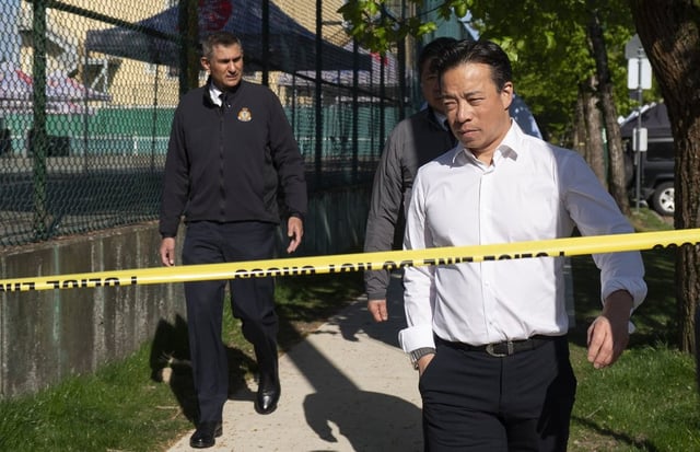 Vancouver Mayor Ken Sim (right) and Vancouver police acting Chief Steve Rai leave after visiting the scene Sunday where a vehicle drove into a crowd at a street festival on Saturday evening in Vancouver. 
