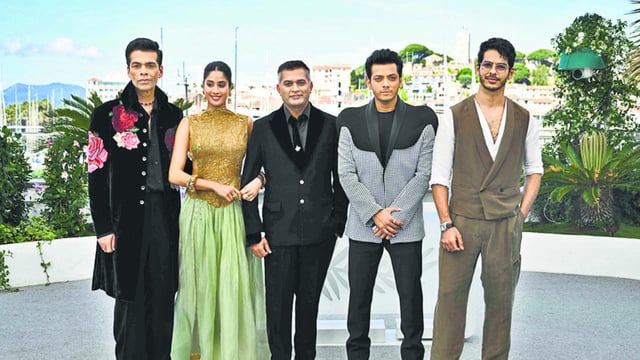 TOPSHOT - (From L) Indian producer Karan Johar, Indian actress Janhvi Kapoor, Indian director and writer Neeraj Ghaywan, Indian actor Vishal Jethwa and Indian actor Ishaan Khatter pose during a photocall for the film Homebound at the 78th edition of the Cannes Film Festival in Cannes, southern France, on May 21, 2025. (Photo by Bertrand GUAY / AFP) (AFP)