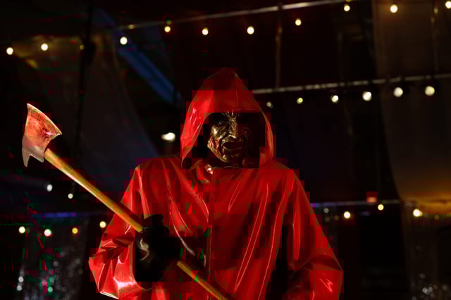 From the black mask and gloves to the red raincoat, the mystery killer in "Fear Street: Prom Queen" was inspired by Italian giallo horror movies.