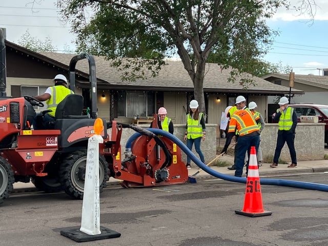 Construction workers installing fiber cables in a west Mesa neighborhood for Google Fiber internet service.