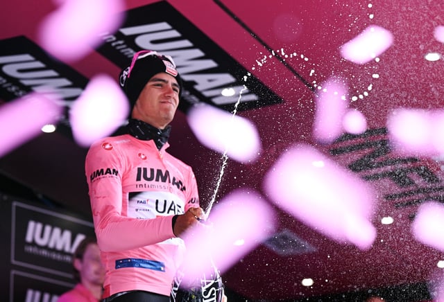 Cycling - Giro d'Italia - Stage 11 - Viareggio to Castelnovo ne' Monti - Italy - May 21, 2025 UAE Team Emirates's Isaac Del Toro celebrates on the podium wearing the maglia rosa jersey REUTERS/Jennifer Lorenzini/File Photo