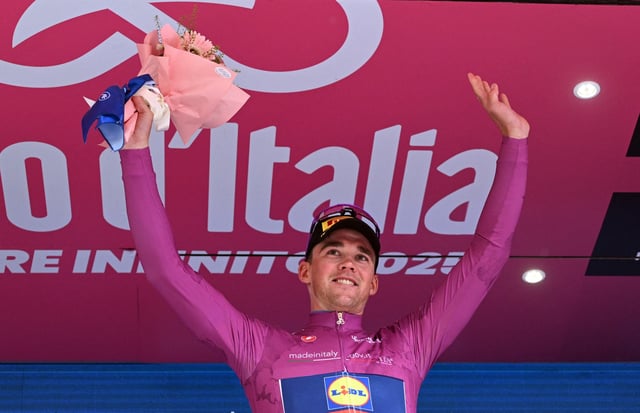 Cycling - Giro d'Italia - Stage 11 - Viareggio to Castelnovo ne' Monti - Italy - May 21, 2025 Lidl - Trek's Mads Pedersen celebrates on the podium wearing the maglia ciclamino jersey REUTERS/Jennifer Lorenzini/File Photo