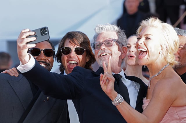 Tramell Tillman (far left), Tom Cruise, Christopher McQuarrie and Hannah Waddingham take a selfie on the "Mission Impossible – The Final Reckoning" red carpet at the Cannes Film Festival.