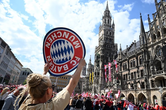Soccer Football - Bundesliga - A Bayern Munich fan displays a giant emblem during the celebrations in the New Town Hall in Munich, Germany - May 18, 2025 REUTERS/Angelika Warmuth/File Photo