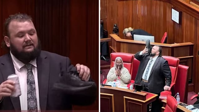 Australian MP Kyle McGinn drinking beer out of his shoe to do a “Shoey”. 