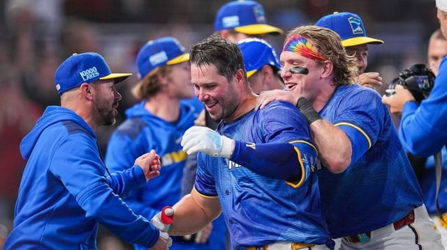 May 23, 2025; Minneapolis, Minnesota, USA; Minnesota Twins outfielder Harrison Bader (12) hugs first base Ty France (13) after his walk off home run against the Kansas City Royals in the ninth inning at Target Field. Mandatory Credit: Brad Rempel-Imagn Images