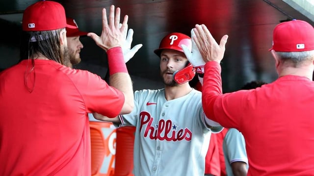 May 23, 2025; West Sacramento, California, USA;  Philadelphia Phillies shortstop Trea Turner (7) is congratulated by teammates in the dugout after hitting a solo home run against the Athletics during the first inning at Sutter Health Park. Mandatory Credit: Dennis Lee-Imagn Images