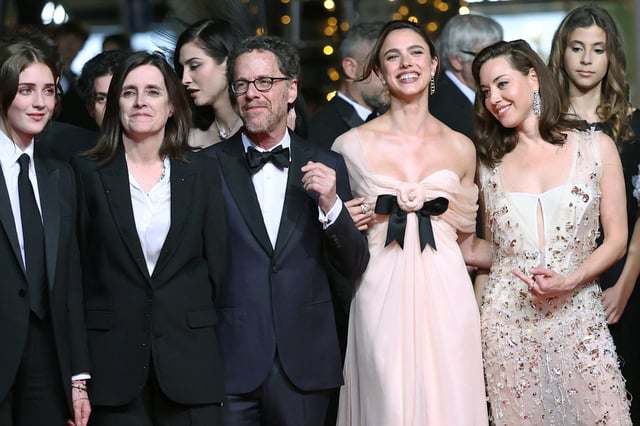 Director Ethan Coen, screenwriter Tricia Cooke, and cast members Margaret Qualley, Aubrey Plaza, and Talia Ryder pose on the red carpet during arrivals for the screening of the film "Honey Don't!" presented as part of midnight screenings at the 78th Cannes Film Festival in Cannes, France, May 24, 2025. REUTERS/Stephane Mahe