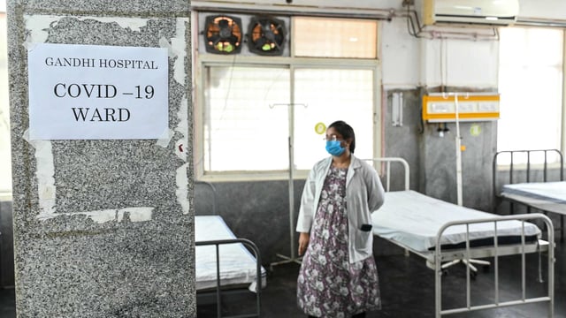 A doctor inspects an isolation ward prepared for the patients with COVID-19 symptoms at a government hospital in Secunderabad.